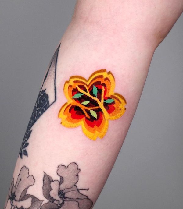 Tatuaggio contemporaneo di fiori di ciliegio di @zoonmo_