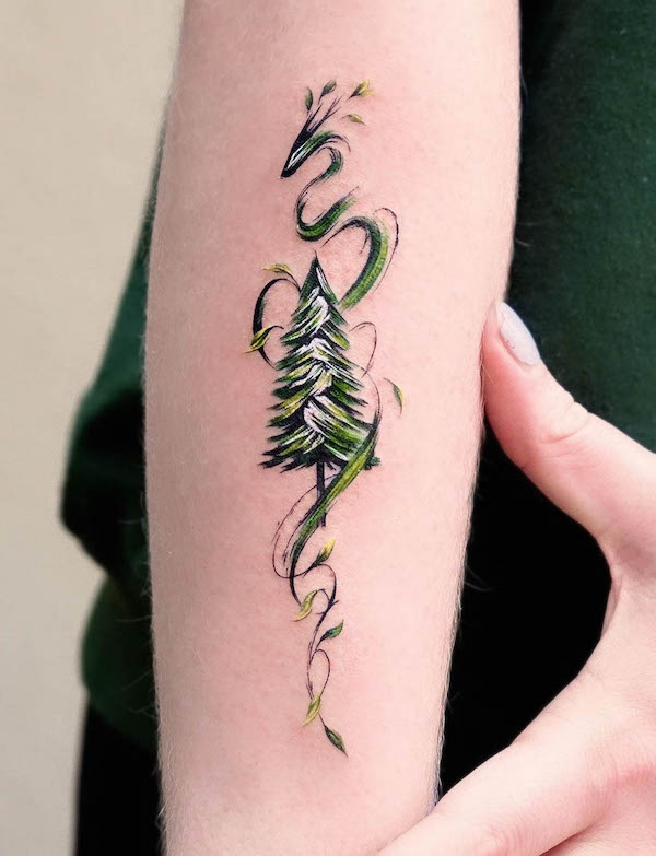 Tatuaggio di drago e albero di @tattooist_zela