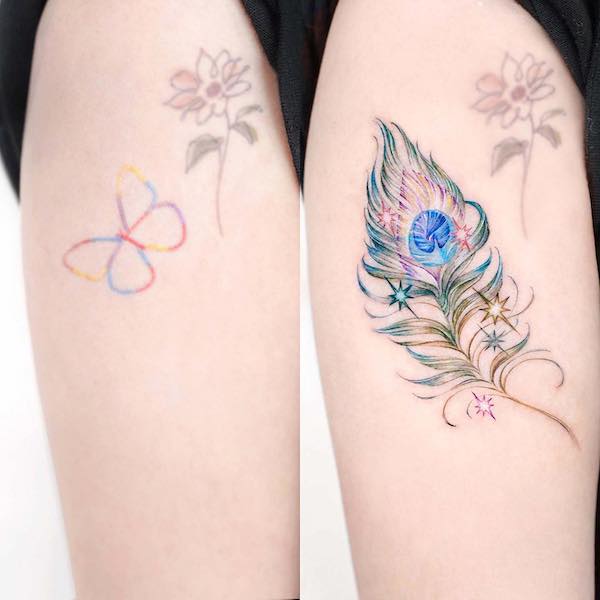 Stupendo tatuaggio di copertura con piume di pavone di @norangtattoo