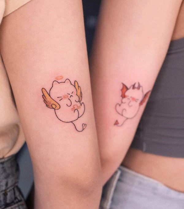 Tatuaggio carino con angelo e diavolo di @eiimoniee