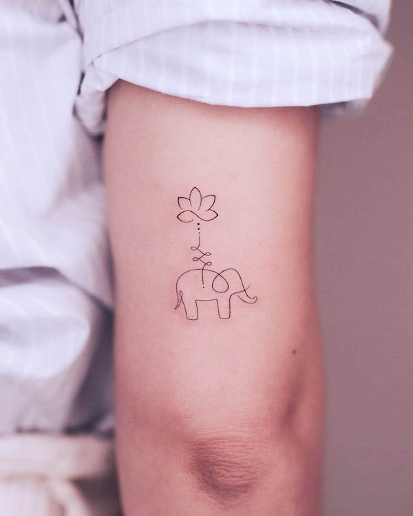 Tatuaggio astratto con loto ed elefante da @clealtattoo