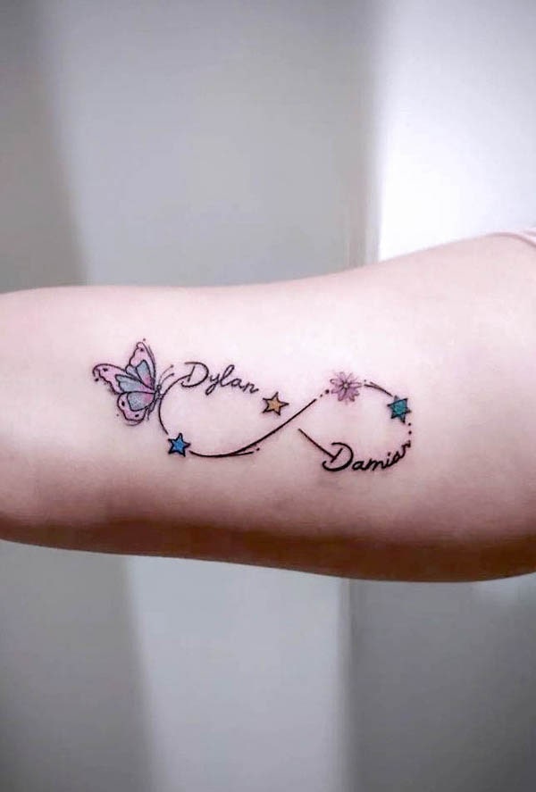 tatuaggio nome infinito con farfalla di @daniel_venomdyt