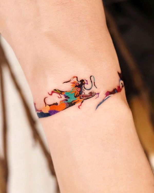 Bracciale con drago orientale tatuato da @tattooist_eq
