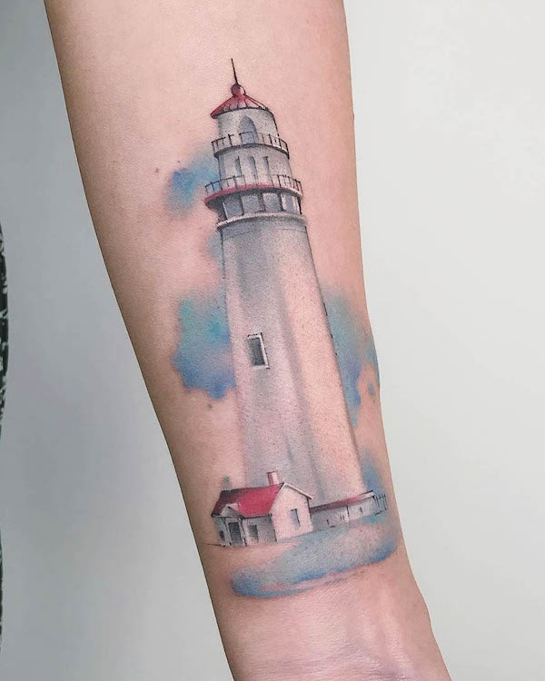Tatuaggio acquerellato di un faro da @goldfishtattoo