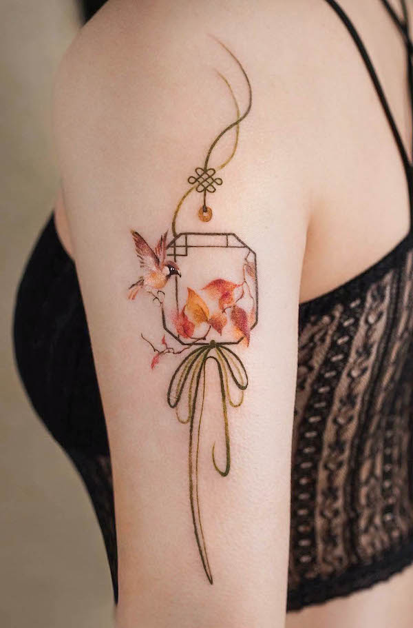 Tatuaggio con passero e norigae coreano di @leean.ink_