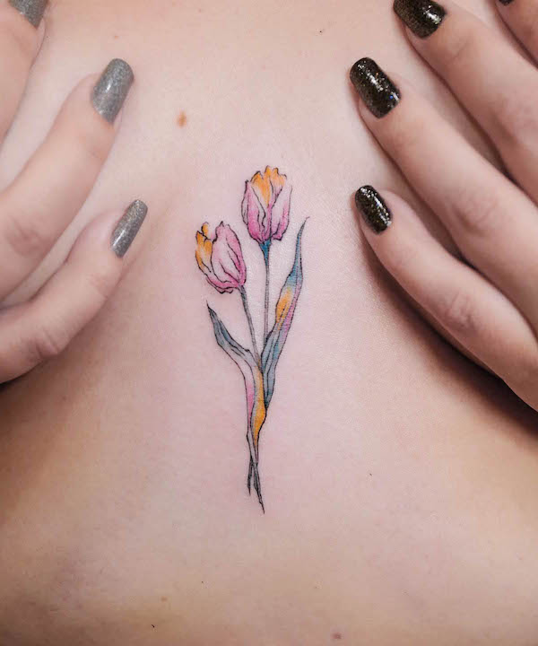 Tatuaggio a tulipano arcobaleno tra le tette di @jessieke_