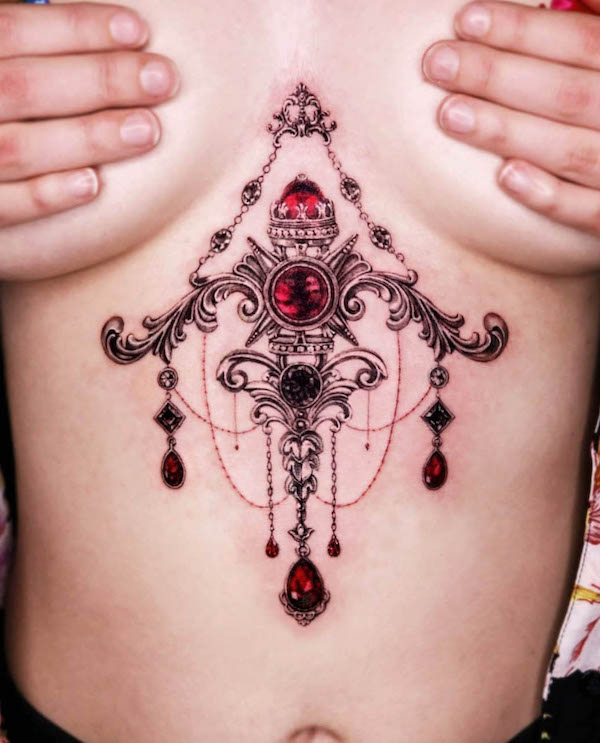 Splendido tatuaggio gemma sullo sterno da @the.hancock.effect