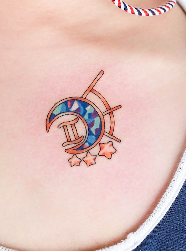 Piccolo tatuaggio con gemma e glifo dei Gemelli di @log_tattoo