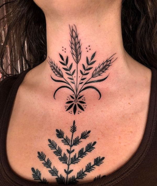 Tatuaggio con simbolo delle piante sulla gola di @annasagetattoos