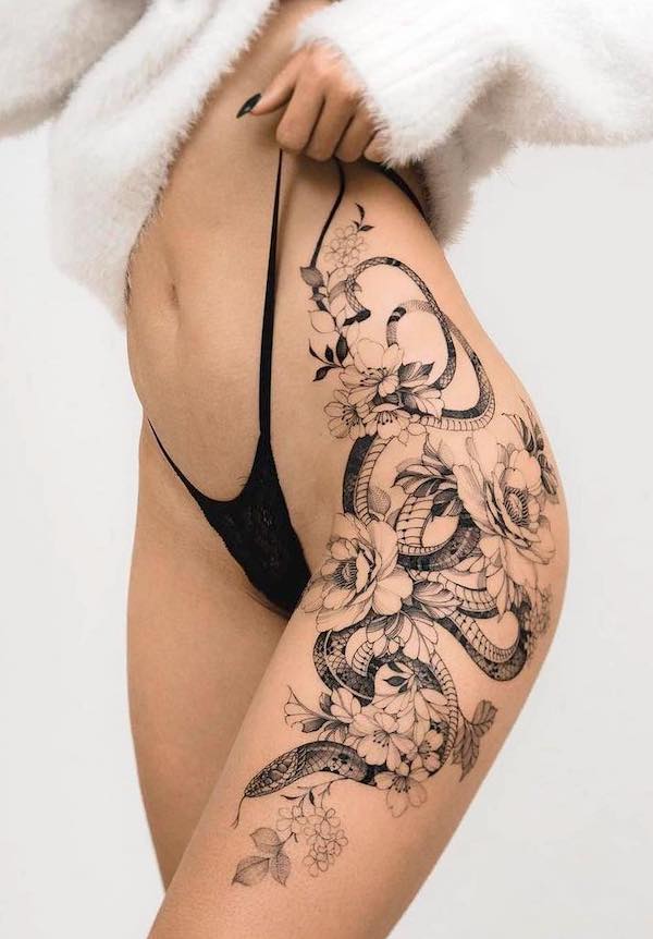 Thigh and waist floral snake tattoo by @blxckink