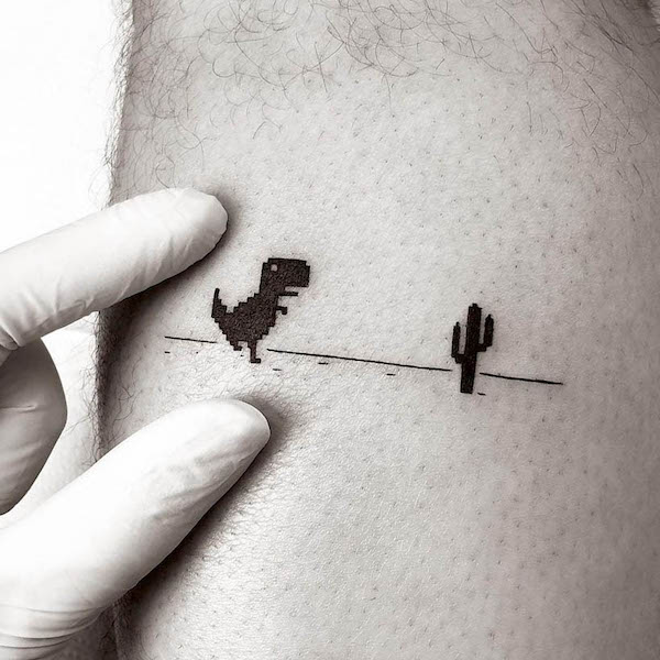 Tatuaggio del gioco T-rex pixel di @teenoca