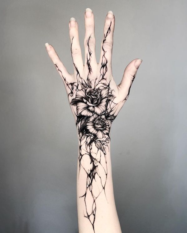 Black rose hand tattoo by @timor_tt - Tatuaggi di rose con significato