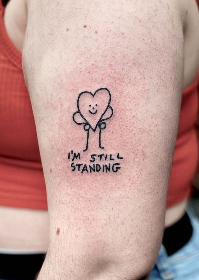 Still standing di @_harrymckenzie - Tatuaggi di positività che vi faranno sorridere
