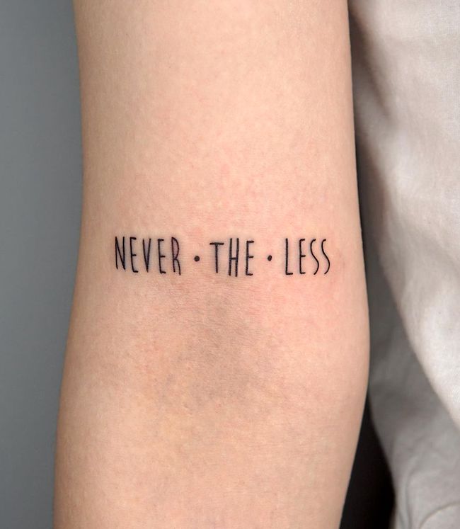 Never.the.less - tatuaggio di una sola parola di @tattooist_zitae